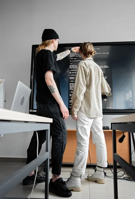 A contemporary workspace showcasing a laptop, tablet, and smartphones, ideal for tech and freelance use.